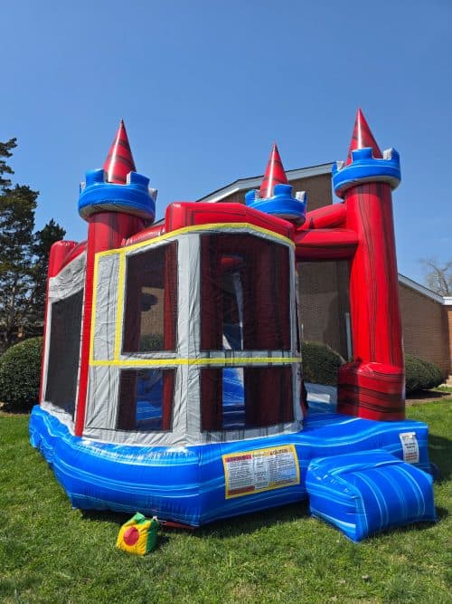 Inflatable castle bounce house with vibrant red, blue, and yellow colors, perfect for children's bir.