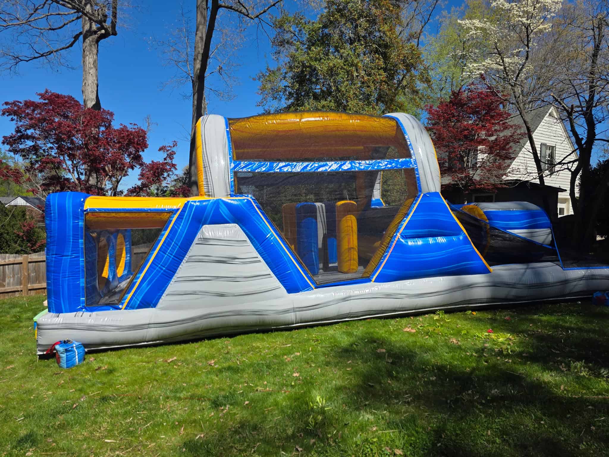 Inflatable obstacle course rental for kids' parties and events. Perfect for outdoor fun and entertai.